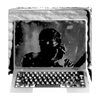 Black and white self portait photo of Austin Metzger in the relfection of a laptop screen. Photo taken by Austin Metzger